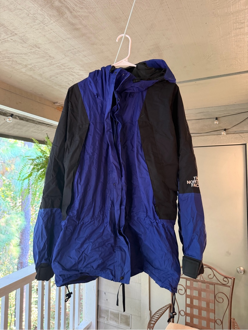 The North Face Blue and Black Hooded Rain Jacket